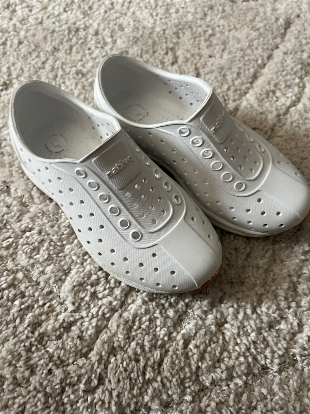 Native White Slip-On Perforated Shoes by Native